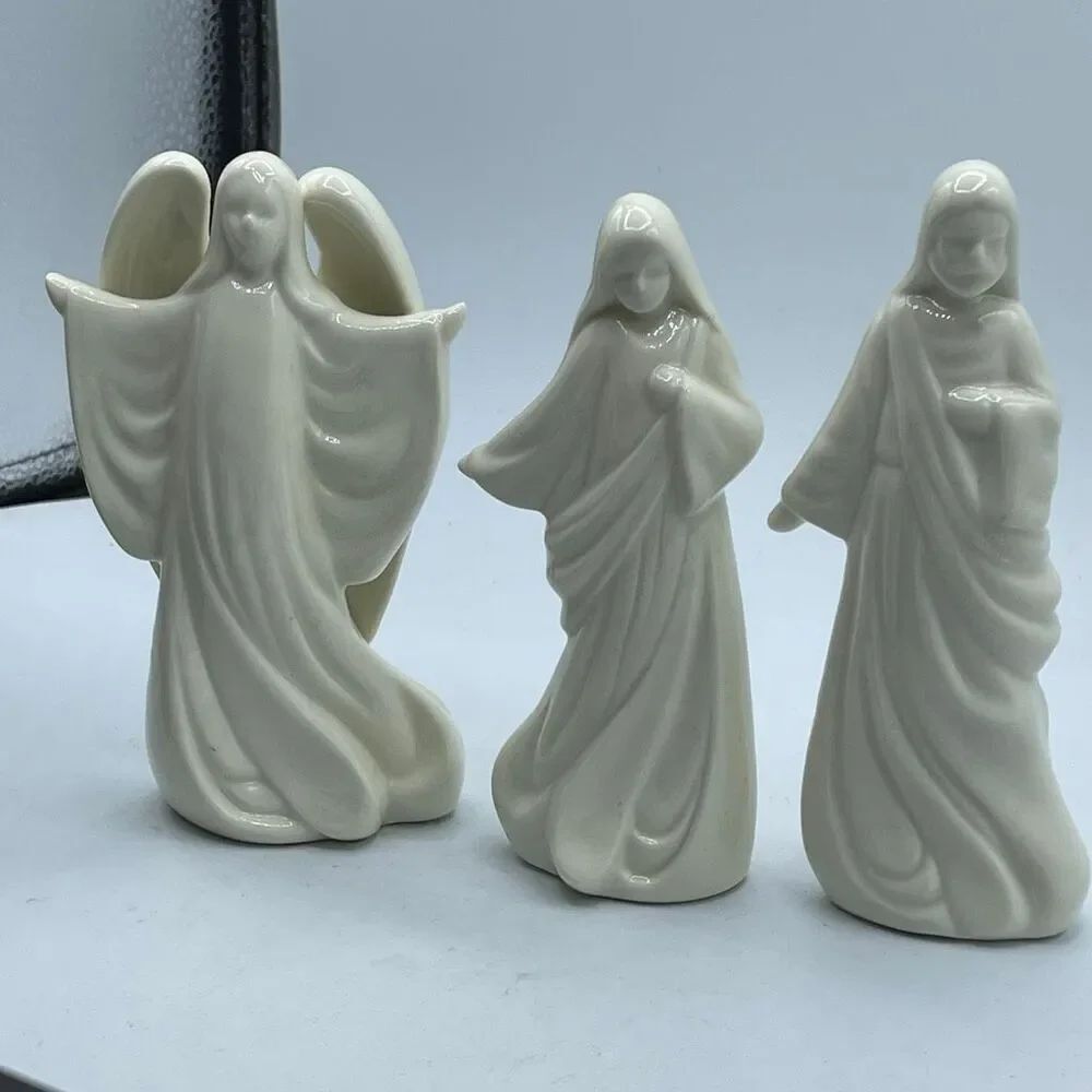 Lot of 3 vintage House of Lloyd Christmas around the World figurines.
